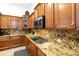Gourmet kitchen features granite countertops, modern appliances, and custom cabinetry at 4229 E Nightingale Ln, Gilbert, AZ 85298