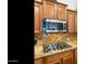 A kitchen with granite countertops, stainless steel appliances, and a gas cooktop at 4229 E Nightingale Ln, Gilbert, AZ 85298