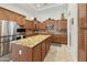 A chef's kitchen with a large island and stainless steel appliances at 4229 E Nightingale Ln, Gilbert, AZ 85298