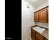 Functional laundry room with cabinets, countertop, and utility sink at 4229 E Nightingale Ln, Gilbert, AZ 85298