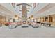 Elegant lobby area with a stone fireplace, cozy seating, and billiard table, providing a comfortable social atmosphere at 4229 E Nightingale Ln, Gilbert, AZ 85298