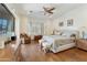 Bright main bedroom with lots of natural light, hardwood flooring, and neutral decor at 4229 E Nightingale Ln, Gilbert, AZ 85298