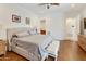 Comfortable main bedroom with a ceiling fan and hardwood flooring at 4229 E Nightingale Ln, Gilbert, AZ 85298