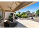 Covered patio with brick flooring, outdoor seating and a grill, perfect for outdoor dining and entertainment at 4229 E Nightingale Ln, Gilbert, AZ 85298