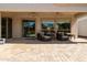 Covered patio with ceiling fans, stylish outdoor seating, and brick flooring, ideal for relaxing outdoors at 4229 E Nightingale Ln, Gilbert, AZ 85298