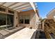 Outdoor patio area featuring a pergola, tiled flooring, and low-maintenance landscaping at 4229 E Nightingale Ln, Gilbert, AZ 85298