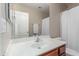 Clean bathroom featuring a white sink, mirror, and a shower with a white curtain at 4817 W St Charles Ave, Laveen, AZ 85339