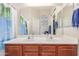 Well-lit bathroom with a double sink vanity and a large mirror at 4817 W St Charles Ave, Laveen, AZ 85339