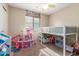 Bright bedroom featuring a playful loft bed, carpeted floors and natural light at 4817 W St Charles Ave, Laveen, AZ 85339