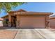 Charming single-story home with a two-car garage, low maintenance landscaping, and a cozy front porch at 4817 W St Charles Ave, Laveen, AZ 85339