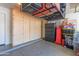 Organized garage featuring custom cabinets, overhead storage racks, and ample space at 4817 W St Charles Ave, Laveen, AZ 85339