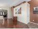 Inviting living room with wood floors and an open layout offering a seamless transition into other living areas at 4817 W St Charles Ave, Laveen, AZ 85339