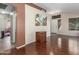 Spacious living room boasting rich wood flooring, an open layout, and lots of natural light at 4817 W St Charles Ave, Laveen, AZ 85339