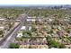 Scenic aerial view of a residential neighborhood featuring tree-lined streets, commercial properties, and local businesses at 530 W Willetta St, Phoenix, AZ 85003