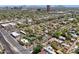 Scenic aerial view of a vibrant neighborhood featuring tree-lined streets, well-maintained homes, and lush landscaping at 530 W Willetta St, Phoenix, AZ 85003