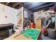 Unfinished basement with painted walls and ceiling, stairway, and a variety of household and personal items at 530 W Willetta St, Phoenix, AZ 85003