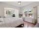 Bright bedroom with large windows and hardwood floors, offering views and natural light at 530 W Willetta St, Phoenix, AZ 85003