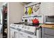 Charming vintage kitchen featuring a classic oven and stainless steel refrigerator for modern convenience at 530 W Willetta St, Phoenix, AZ 85003