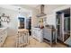 Charming kitchen with vintage oven, stainless steel range hood, tiled floors, and adjacent dining area at 530 W Willetta St, Phoenix, AZ 85003