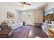 Bright living room with a comfortable sofa, decorative cabinet, and hardwood floors with a rug at 530 W Willetta St, Phoenix, AZ 85003
