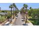 Scenic street view lined with mature palm trees and lush landscaping under a clear sky at 530 W Willetta St, Phoenix, AZ 85003
