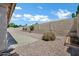 Backyard area with gravel landscape and partial view of a desert garden at 6368 W Firebird Dr, Glendale, AZ 85308