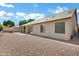 Large backyard featuring gravel landscaping and a well maintained tiled roof at 6368 W Firebird Dr, Glendale, AZ 85308