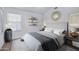 Serene bedroom featuring calming colors, stylish decor, and ample natural light at 6368 W Firebird Dr, Glendale, AZ 85308