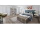 Inviting bedroom featuring a plush bed, cozy bench, modern shelving, and soft, bright colors at 6368 W Firebird Dr, Glendale, AZ 85308