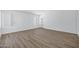 Empty bedroom featuring new wood-look floors and bright natural light at 6368 W Firebird Dr, Glendale, AZ 85308