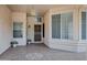 Inviting covered front porch featuring neutral colors, decorative flooring, and a secure entry door at 6368 W Firebird Dr, Glendale, AZ 85308