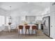 Bright kitchen with stainless steel appliances, a large island with bar seating and eat in dining at 6368 W Firebird Dr, Glendale, AZ 85308