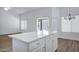 Bright kitchen featuring wood-look floors and center island at 6368 W Firebird Dr, Glendale, AZ 85308