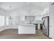 Spacious kitchen with a center island, stainless steel appliances, and light countertops at 6368 W Firebird Dr, Glendale, AZ 85308