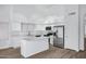 Well-lit kitchen boasts stainless appliances, light countertops, and a functional island at 6368 W Firebird Dr, Glendale, AZ 85308