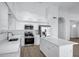 Modern kitchen equipped with stainless steel appliances and a bright center island at 6368 W Firebird Dr, Glendale, AZ 85308