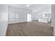 Bright living room features wood-look floors, and a ceiling fan at 6368 W Firebird Dr, Glendale, AZ 85308