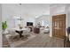 Open-concept living space boasts natural light, modern finishes, and seamless flow to dining at 6368 W Firebird Dr, Glendale, AZ 85308