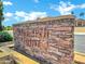 Monarch Point community sign made of stacked stone with decorative lettering at 6368 W Firebird Dr, Glendale, AZ 85308