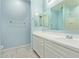 Bright bathroom with large mirror and a vanity sink at 7620 W Pioneer St, Phoenix, AZ 85043