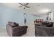 Open-concept living space featuring tile flooring and access to the dining area at 7620 W Pioneer St, Phoenix, AZ 85043