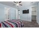 This spacious main bedroom boasts a ceiling fan, a walk-in closet, and an en-suite bathroom, offering comfort and convenience at 7620 W Pioneer St, Phoenix, AZ 85043
