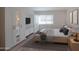 Calm bedroom with a wood platform bed, neutral decor, and generous closet space at 7970 E Camelback Rd # 101, Scottsdale, AZ 85251