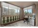 Bright room with large windows, desk, chair, and geometric patterned rug, offering neighborhood views at 7970 E Camelback Rd # 101, Scottsdale, AZ 85251