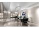 Elegant lobby with modern seating, crystal chandelier, contemporary art, and sleek tiled flooring at 7970 E Camelback Rd # 101, Scottsdale, AZ 85251