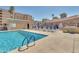 Inviting outdoor pool and deck area complete with lounge chairs and a nearby grilling area at 7970 E Camelback Rd # 101, Scottsdale, AZ 85251