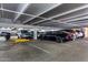 Spacious covered parking garage with multiple vehicles and ample room for convenient parking at 7970 E Camelback Rd # 101, Scottsdale, AZ 85251