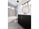 Updated bathroom with a black vanity, sleek mirror, and modern fixtures, enhancing its appeal at 8133 W Mclellan Rd, Glendale, AZ 85303