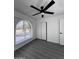Bedroom featuring ceiling fan, laminate flooring, and large window at 8133 W Mclellan Rd, Glendale, AZ 85303