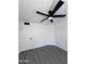 Bedroom featuring ceiling fan, laminate flooring, and a white door at 8133 W Mclellan Rd, Glendale, AZ 85303